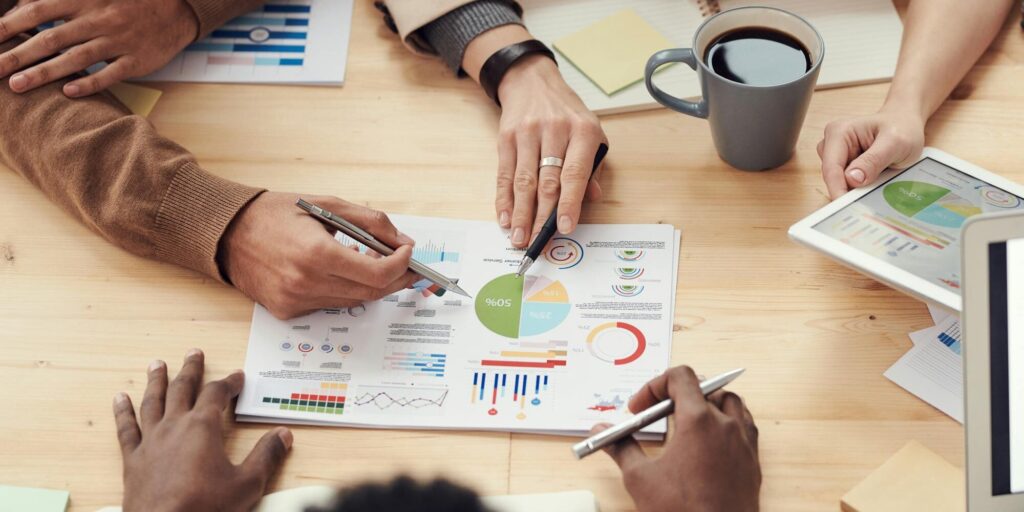 people at the office discussing a chart