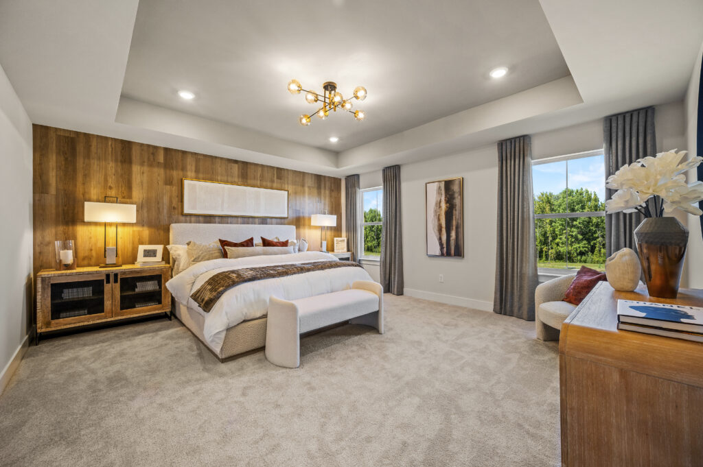 large bedroom with wood wall and king size bed